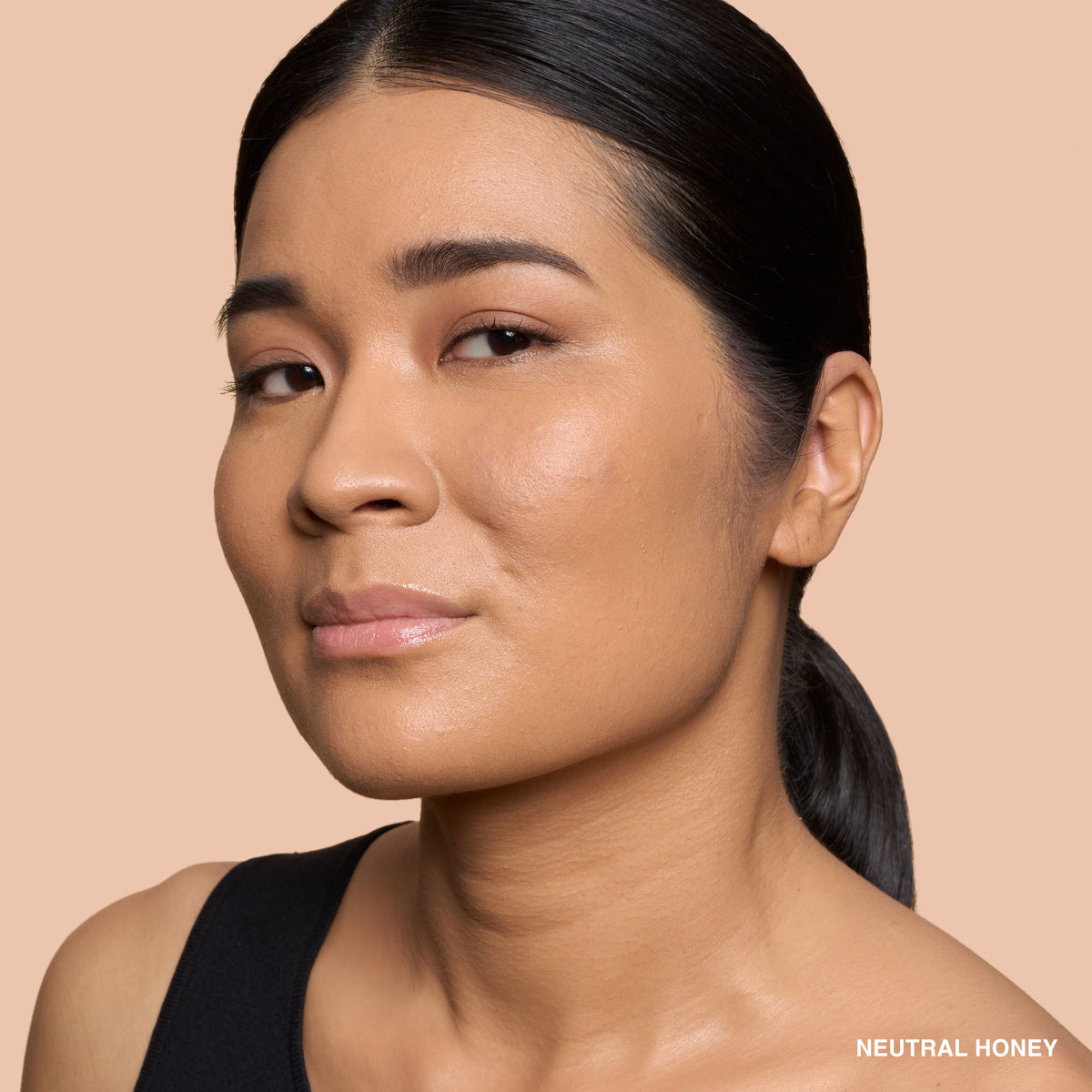 Bobbi Brown Weightless Skin Natural Matte Finish Foundation SPF 15 in Neutral Honey, bottle with pump and foundation swatch.