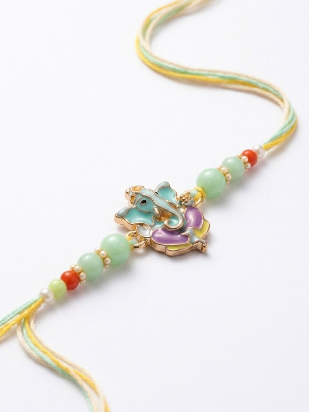 Indyancart Multicolor Artificial Beads Ganesh Ji Thread Rakhi With Roli Chawal Chandan Mishri