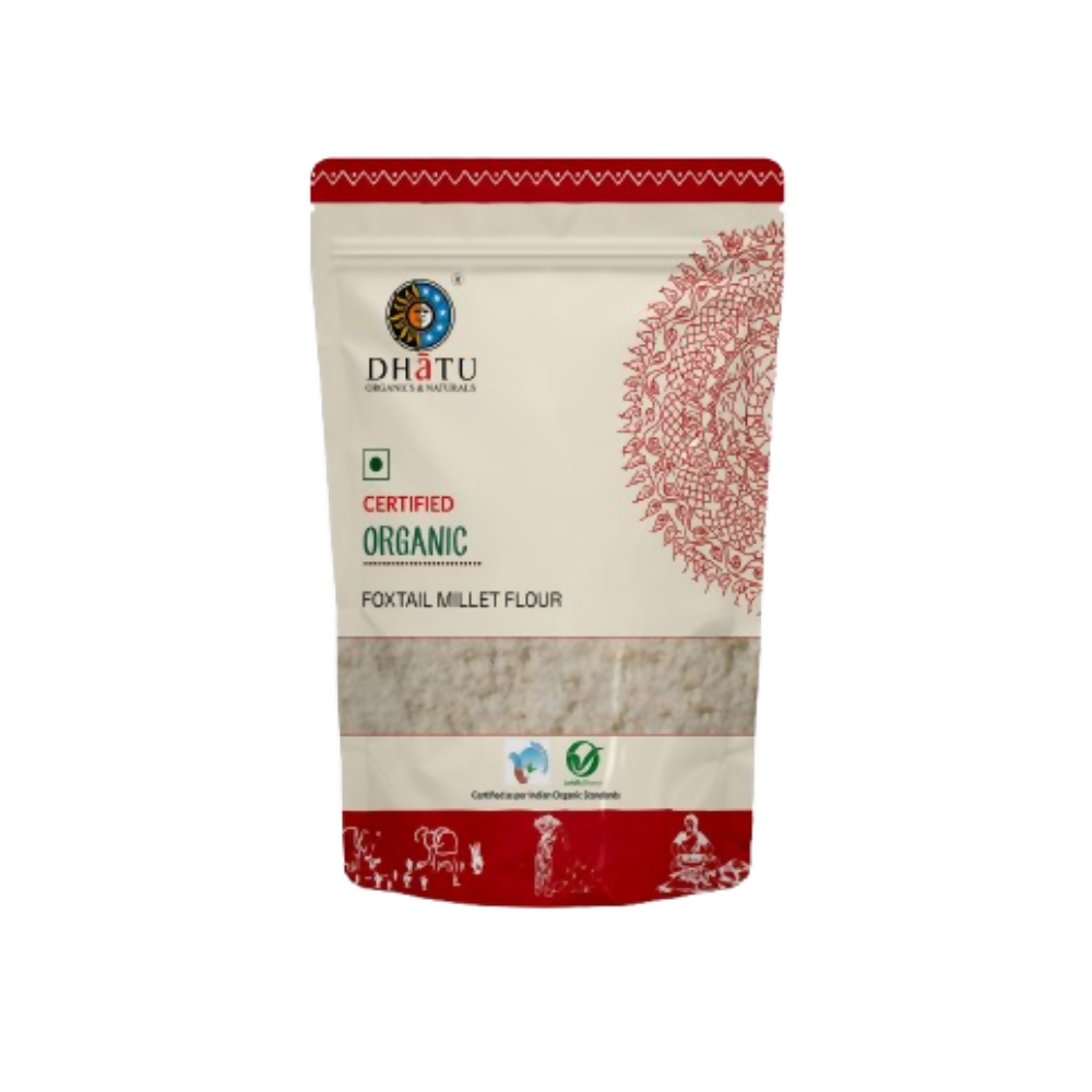 Dhatu Organics & Naturals foxtail millet flour in a bowl, showcasing light beige millet flour with a natural, textured surface.