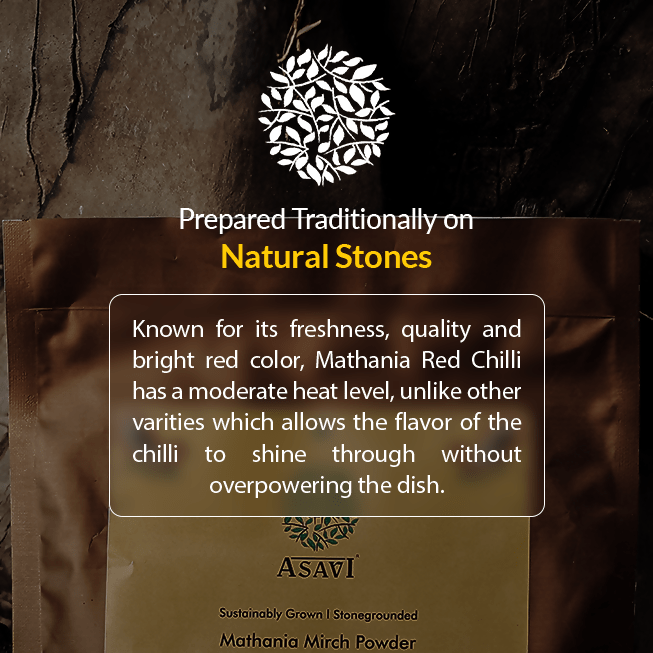 Asavi Stone Grounded Mathania Chilli Powder in a jar showing vibrant red chili flakes and powder inside.