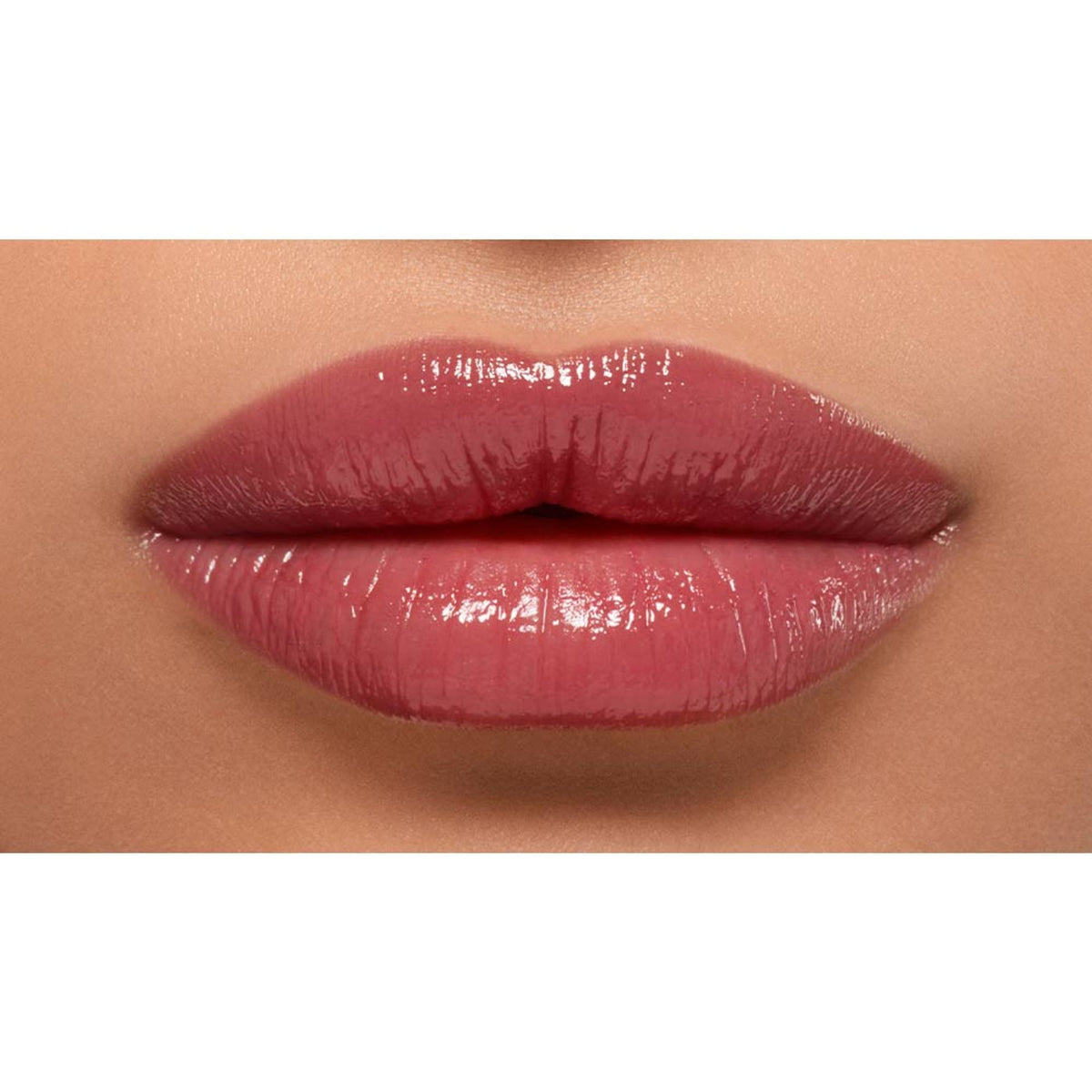 Lancome Lip Idole Butterglow Hydrating Lip Balm in 60 Million Dollar Berry, showing glossy, smooth lips with a rich berry tint.