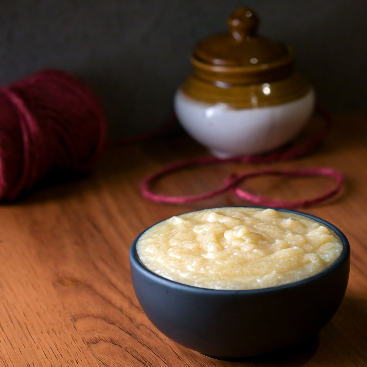 Vellanki Foods Buffalo Ghee in a glass jar, showing the rich, golden ghee with a smooth texture and label.
