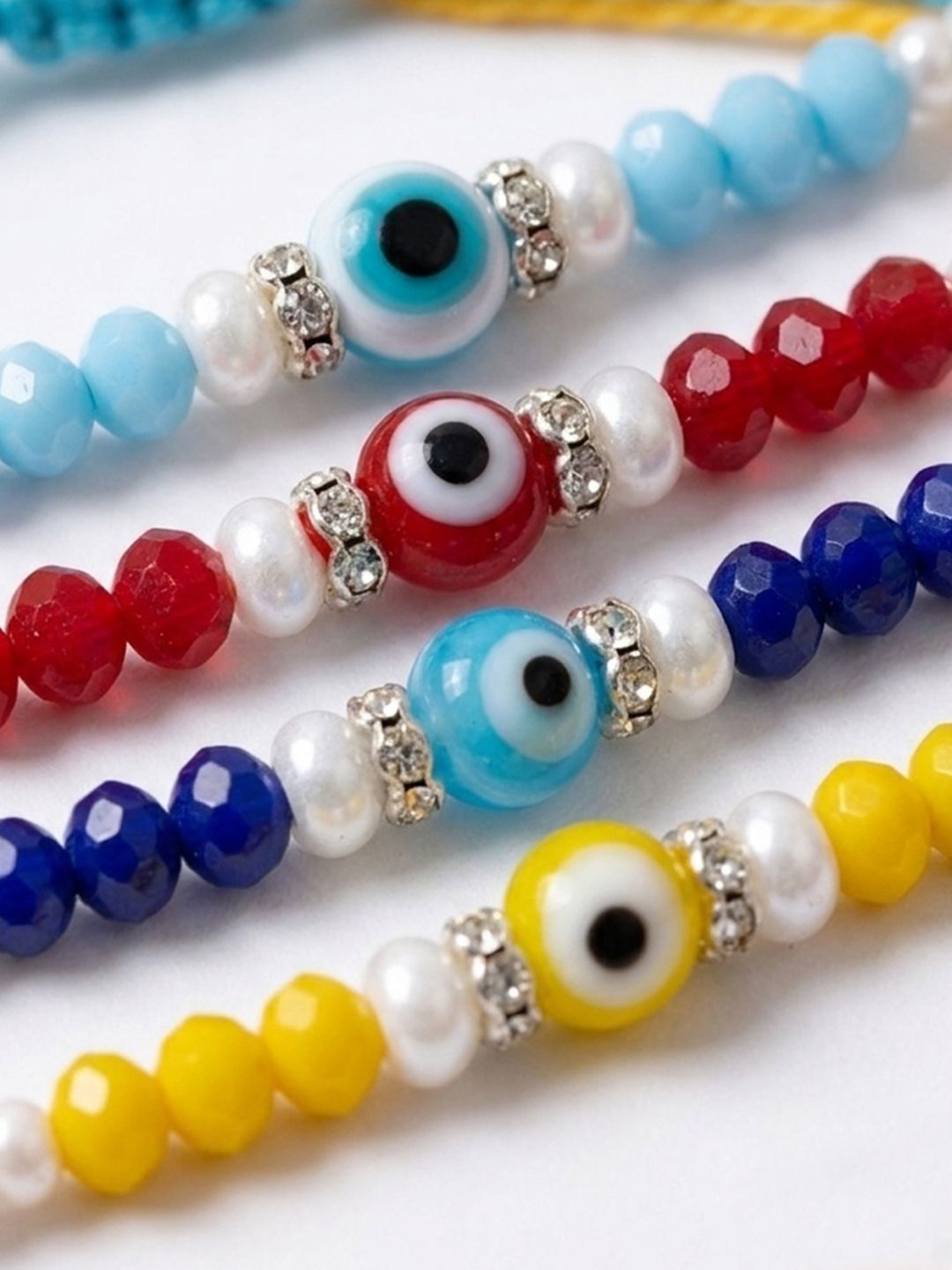 Indyancart Set Of 4 Multicolor Evil Eye Thread Rakhi With Roli Chawal Chandan Mishri