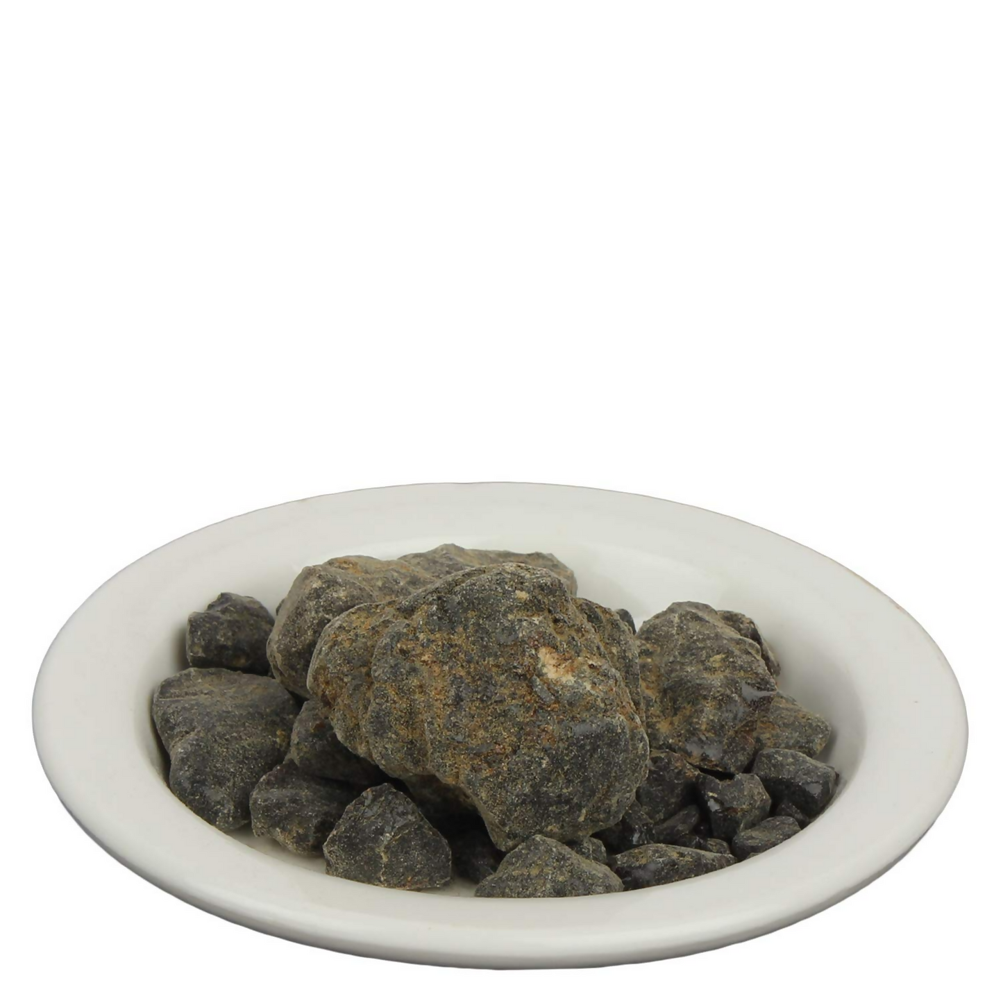 Yuvika Sakmuniya Dali - Ayurvedic Convolvulus Scammonia seeds in a small glass container with a green leaf background