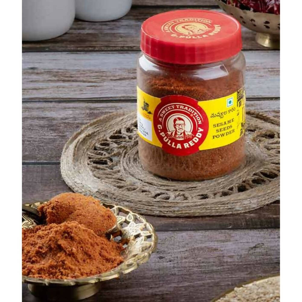 Jar of G Pulla Reddy Sweets Nuvvula Karam Powder, a traditional Indian spice blend in a clear glass container.