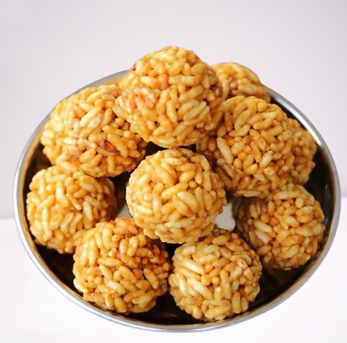 Godavari Vantillu Murmura Laddu, North Indian sweet with crispy puffed rice and jaggery, served in a traditional bowl.