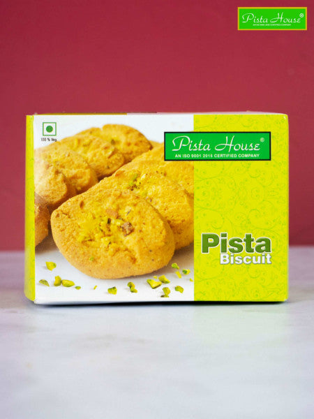 Pista House Pista Biscuits displayed on a plate, showcasing golden-brown pistachio-flavored cookies with pistachio pieces.