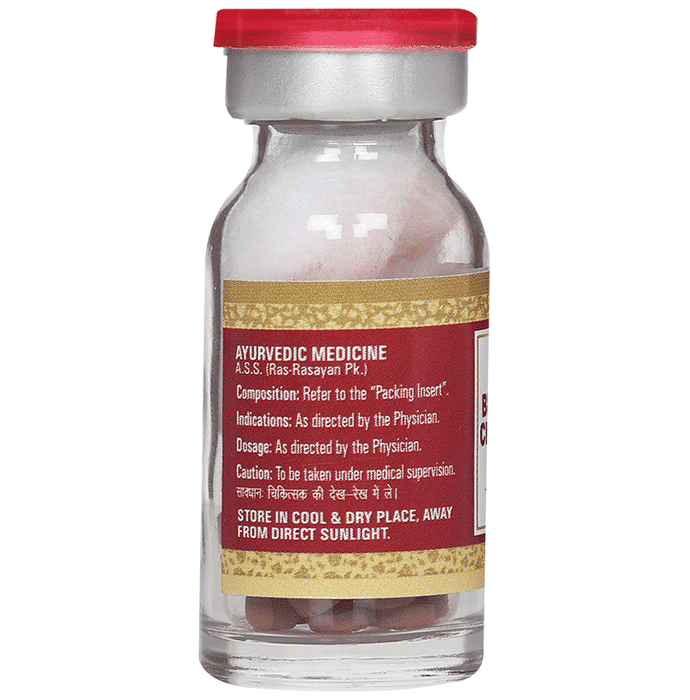 Multani Brihat Vat Chintamani Ras Ayurvedic tablets with gold, shown in a transparent container with tablets inside.