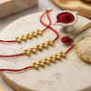 Dhiyona Set Of 3 Gold Toned Ghungroo & Red Thread Rakhi With Roli Chawal Chandan Mishri
