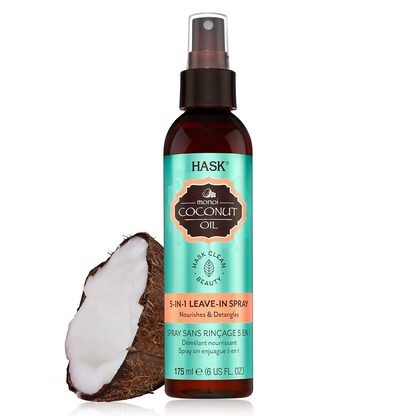 HASK Monoi Coconut Oil Leave-In Hair Spray in a clear spray bottle with a white and purple label, designed for nourishing hair.