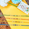 Dhiyona Set Of 4 Multicolor Artificial Beads Thread Rakhi With Roli Chawal Chandan Mishri