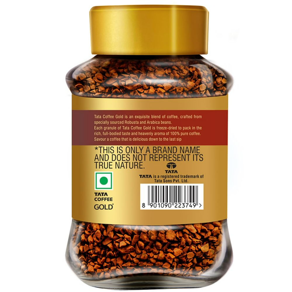 Tata Coffee Gold Original instant coffee jar with coffee powder, showcasing the label and open lid.