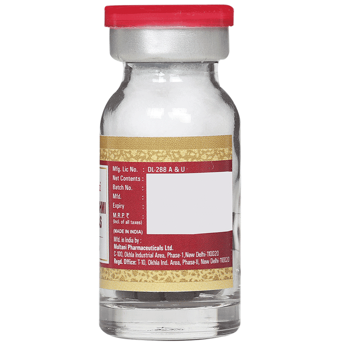 Multani Mahalaxmi Vilas Ras Ayurvedic tablets with gold, traditional herbal medicine in a glass container.