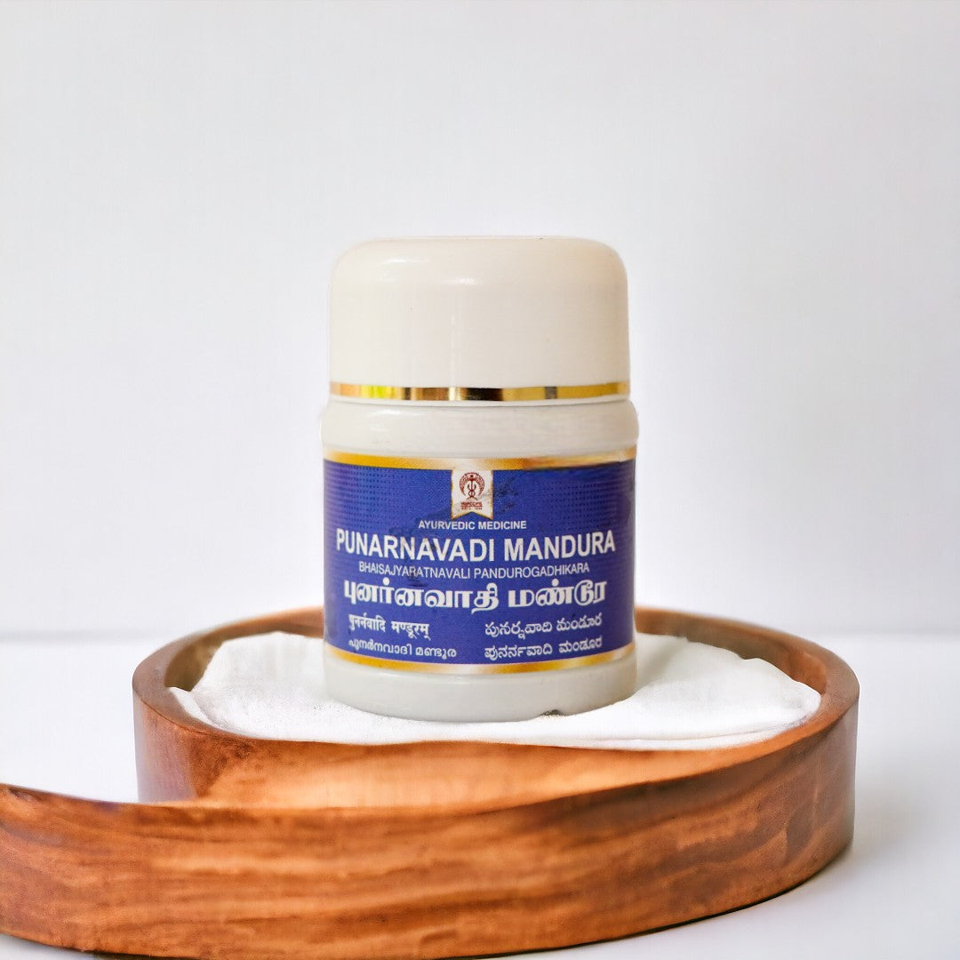 ImpCops Punarnavadi Mandura Ayurvedic tablets shown in a glass jar with label, surrounded by traditional herbs and ingredients.