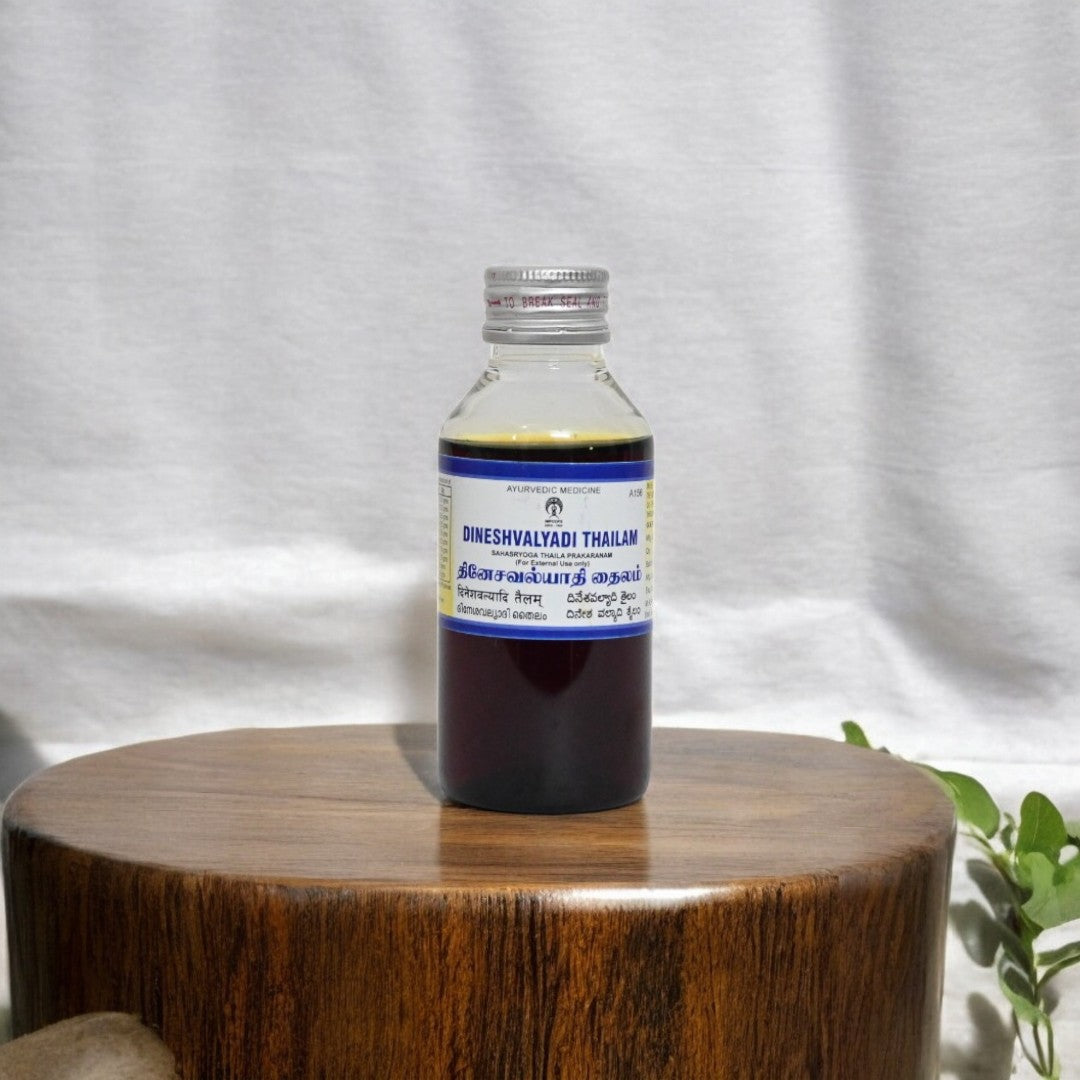 ImpCops Dineshavalyadi Ayurvedic Thailam in a glass bottle with dropper, traditional herbal medicinal oil for wellness.