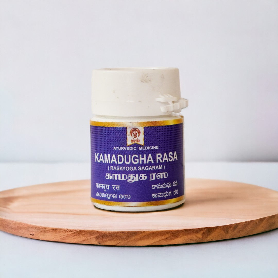 Impcops Kamadugha Rasa Ayurvedic product in a glass jar with label, showcasing traditional herbal medicine packaging.