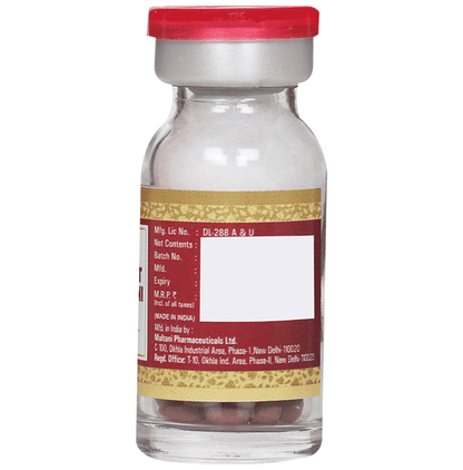 Multani Brihat Vat Chintamani Ras Ayurvedic tablets with gold in a clear container, showcasing traditional herbal medicine.