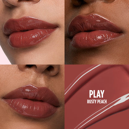 Nykaa Lip Grip No-Transfer Gloss in Play with intense shine, vinyl liquid lipstick in a sleek tube, showcasing vibrant color.