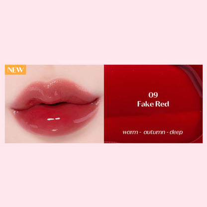 ETUDE Over Glowy Tint in Fake Red, a vibrant lip tint with a glossy finish, displayed in a sleek tube on a white background.