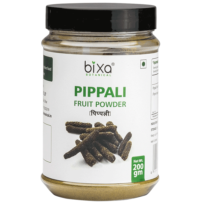Bixa Botanical Pippali Powder in a clear glass jar, showing fine orange-red Ayurvedic herbal powder for wellness uses
