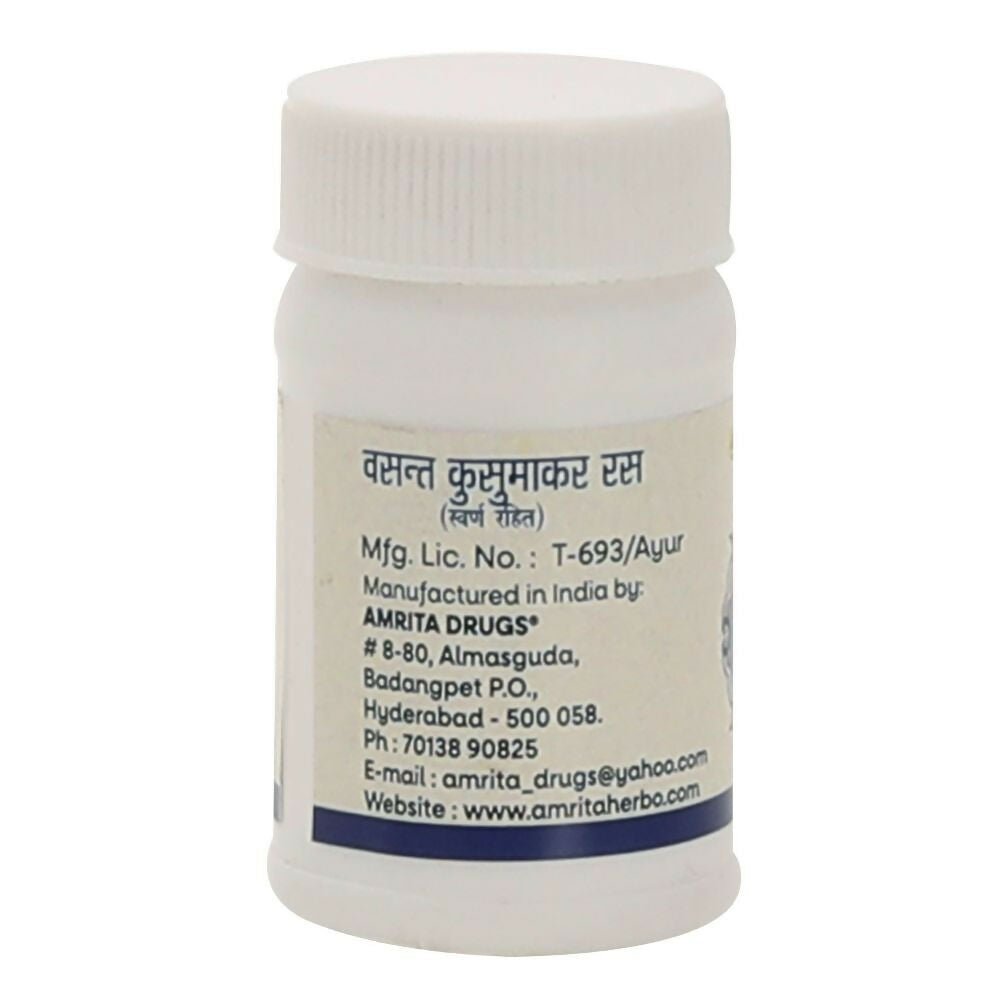 Amrita Vasant Kusumakar Ras Ayurvedic tablets in a glass bottle with blister packs, showcasing traditional herbal medicine.