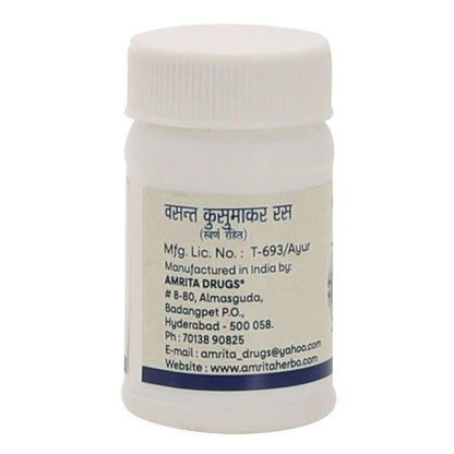 Amrita Vasant Kusumakar Ras Ayurvedic tablets in a glass bottle with blister packs, showcasing traditional herbal medicine.