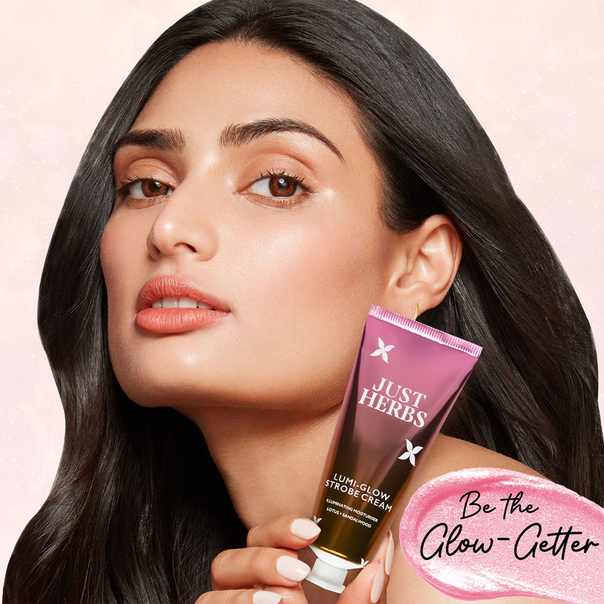 Just Herbs Lumi Glow Golden Strobe Cream with sunlit gleam, showing a close-up of the radiant, luminous cream in a jar.
