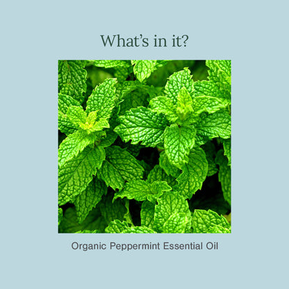 Juicy Chemistry organic peppermint essential oil in a small glass bottle with a dropper cap, showing the product label.