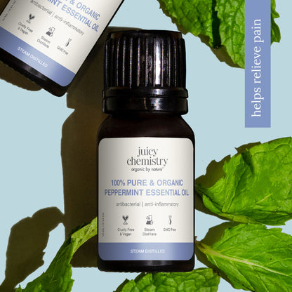 Bottle of Juicy Chemistry 100% pure organic peppermint essential oil with a green label and dropper cap.