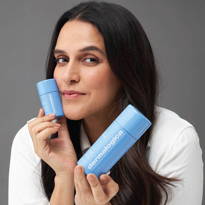 Dermalogica Daily Milkfoliant gentle oat-based powder exfoliant in a jar, vegan skincare product with a scoop for easy use