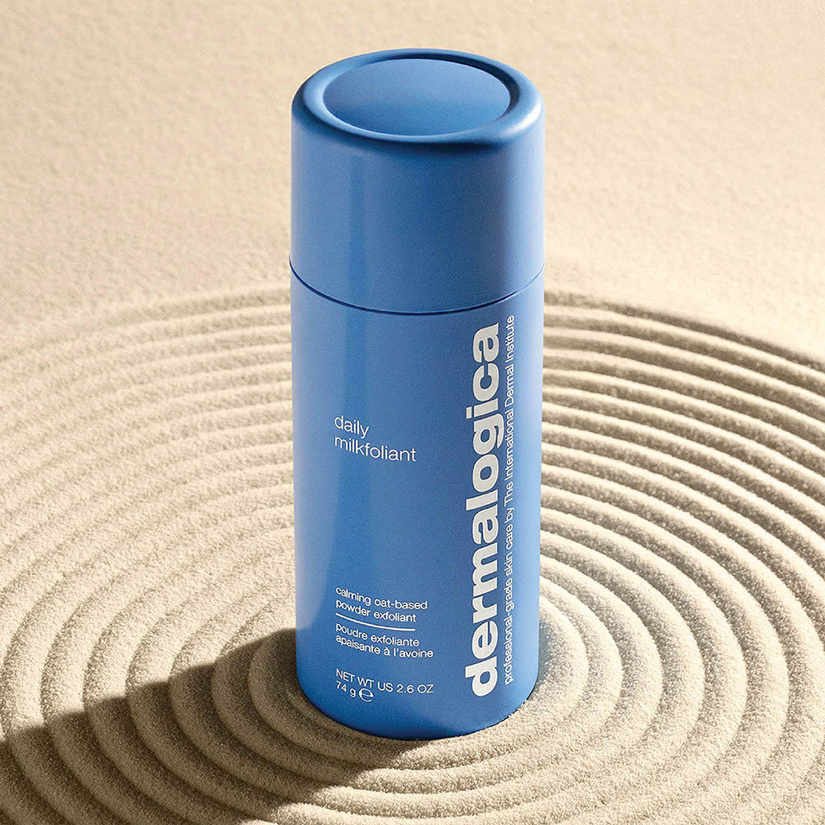Dermalogica Daily Milkfoliant gentle oat-based powder exfoliant in a clear jar, showing the soft white powder inside.