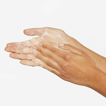 Dermalogica Daily Milkfoliant vegan oat-based powder exfoliant in a white container with a silver lid.