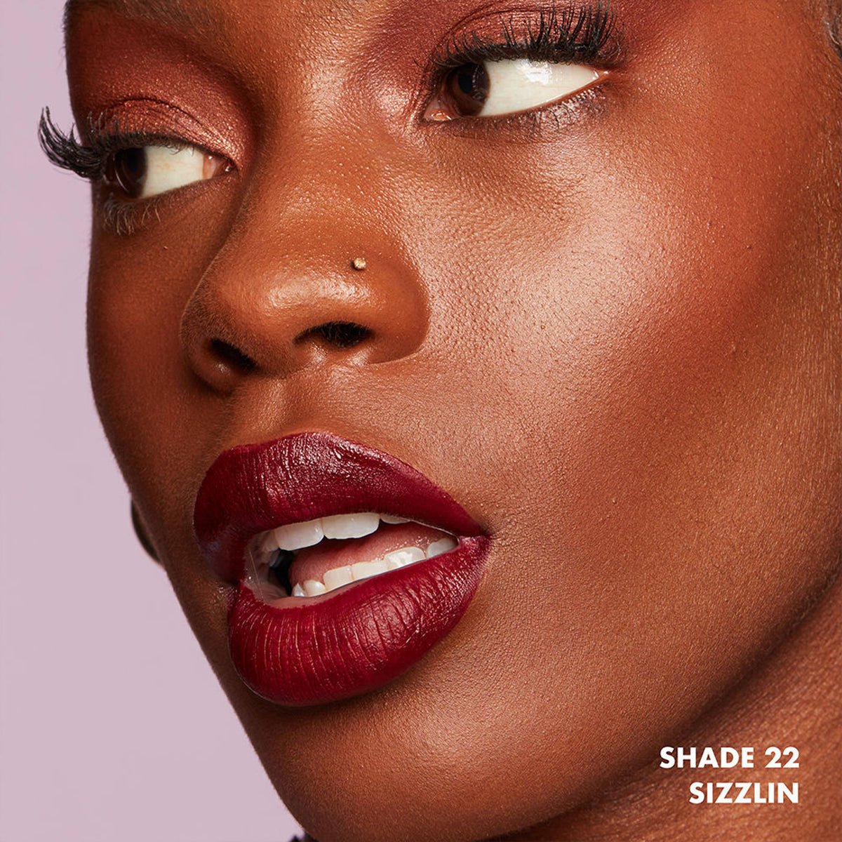 NYX Professional Makeup Lip Lingerie XXL Matte Liquid Lipstick in Sizzlin, showing the deep red liquid lipstick tube and applicator.
