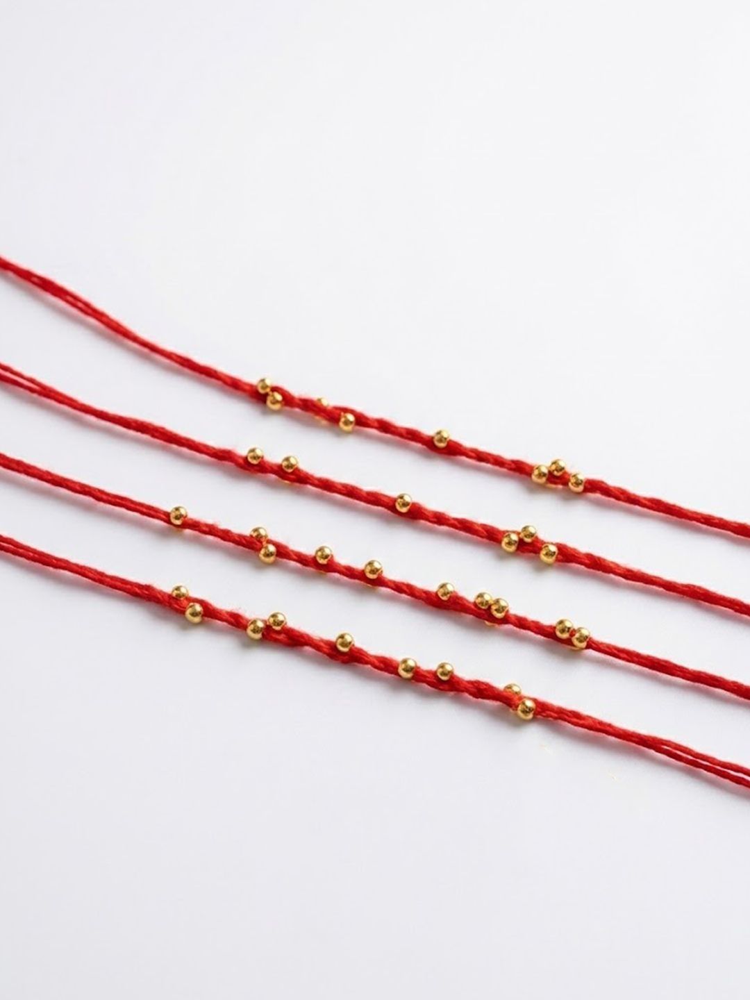Anouk Set Of 4 Traditional Red Thread Rakhi With Roli Chawal Chandan Mishri