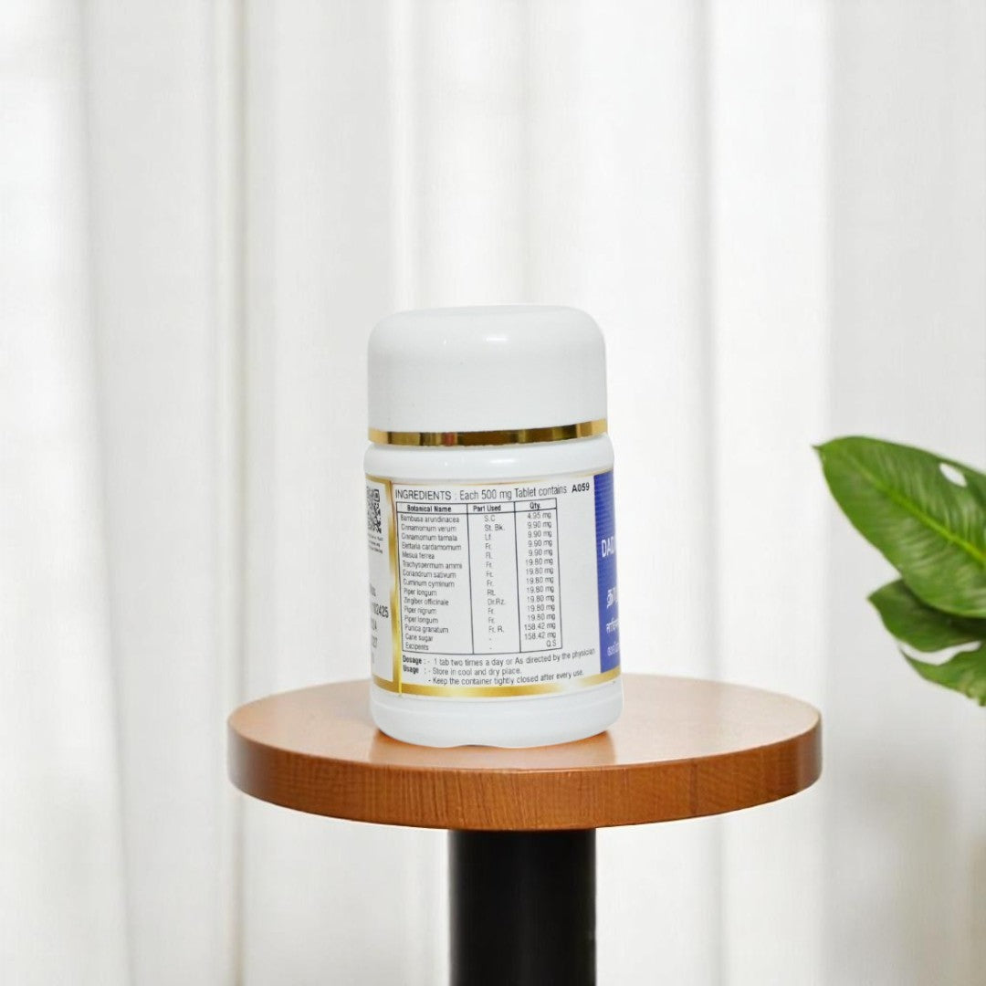 Impcops Dadimashtaka Churnam Ayurvedic tablets in a glass jar with tablets visible inside.
