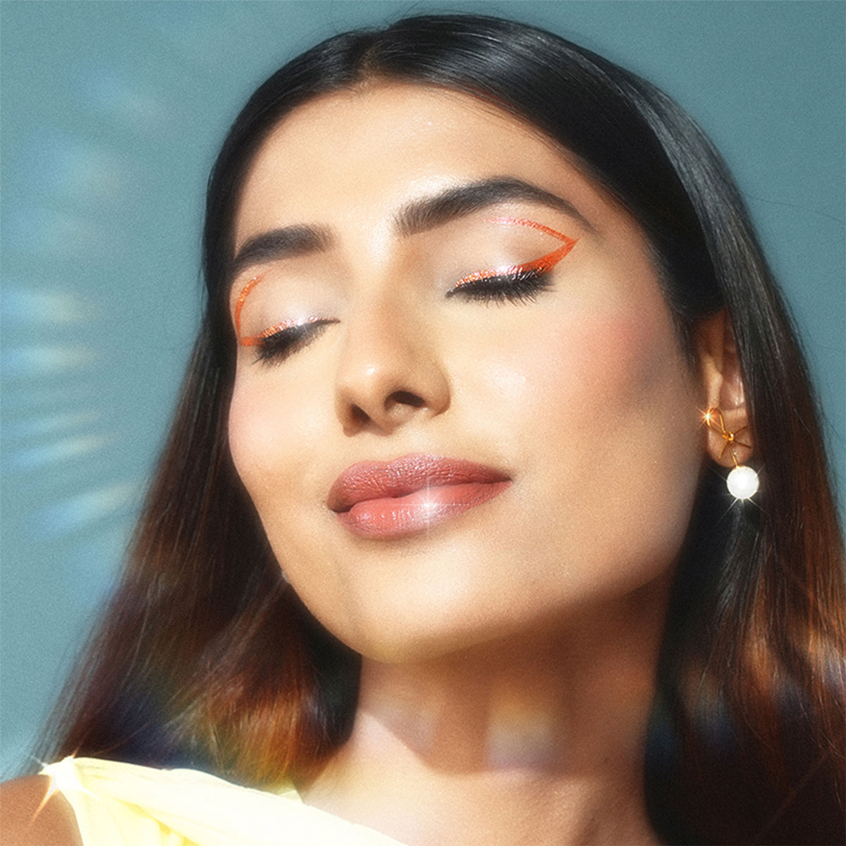Bella Vita Organic Fantasy Beams holographic eyeliner in Phoenix Fire with vibrant, shimmering pink and orange hues.