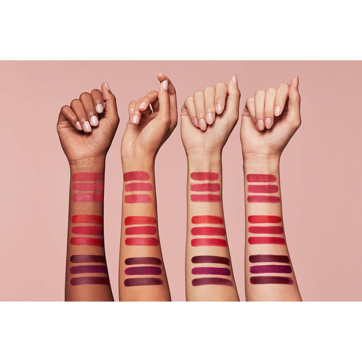 Estee Lauder Pure Color Whipped Matte Lip Color in Maraschino, showcasing the vibrant red lipstick in a sleek tube.