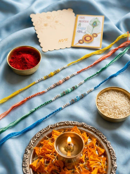 Anouk Set Of 4 Multicolor Artificial Beads Thread Rakhi With Roli Chawal Chandan Mishri