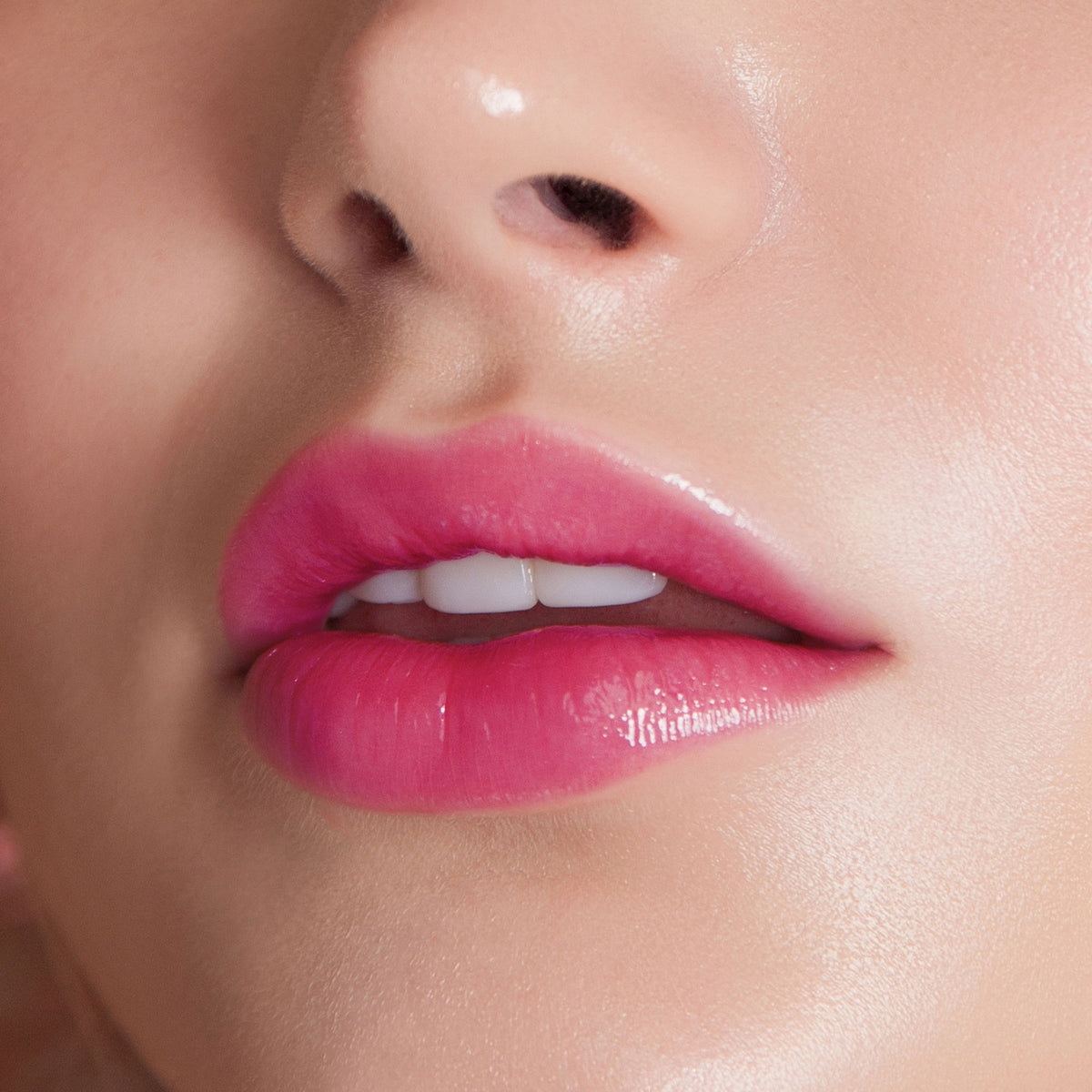 Colors Queen Lips Color Lip Balm in vibrant tube, featuring bright pink packaging and the balm applicator inside.