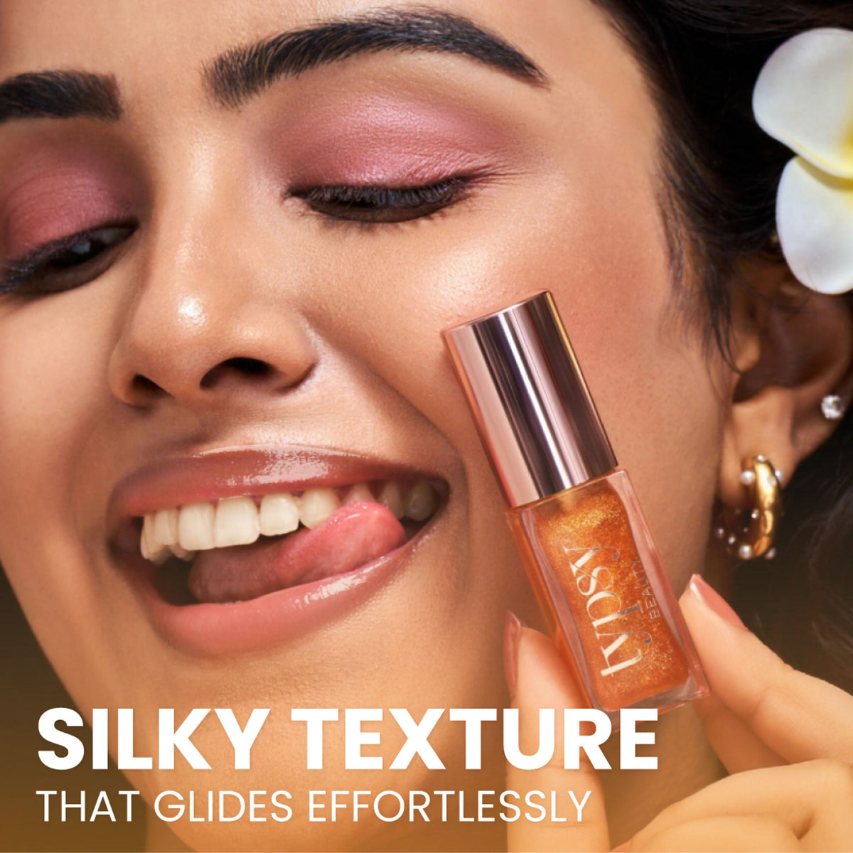 Typsy Beauty Hi Honey! SPF 25 Lip Oil in a clear tube with a honey-colored liquid and applicator brush.