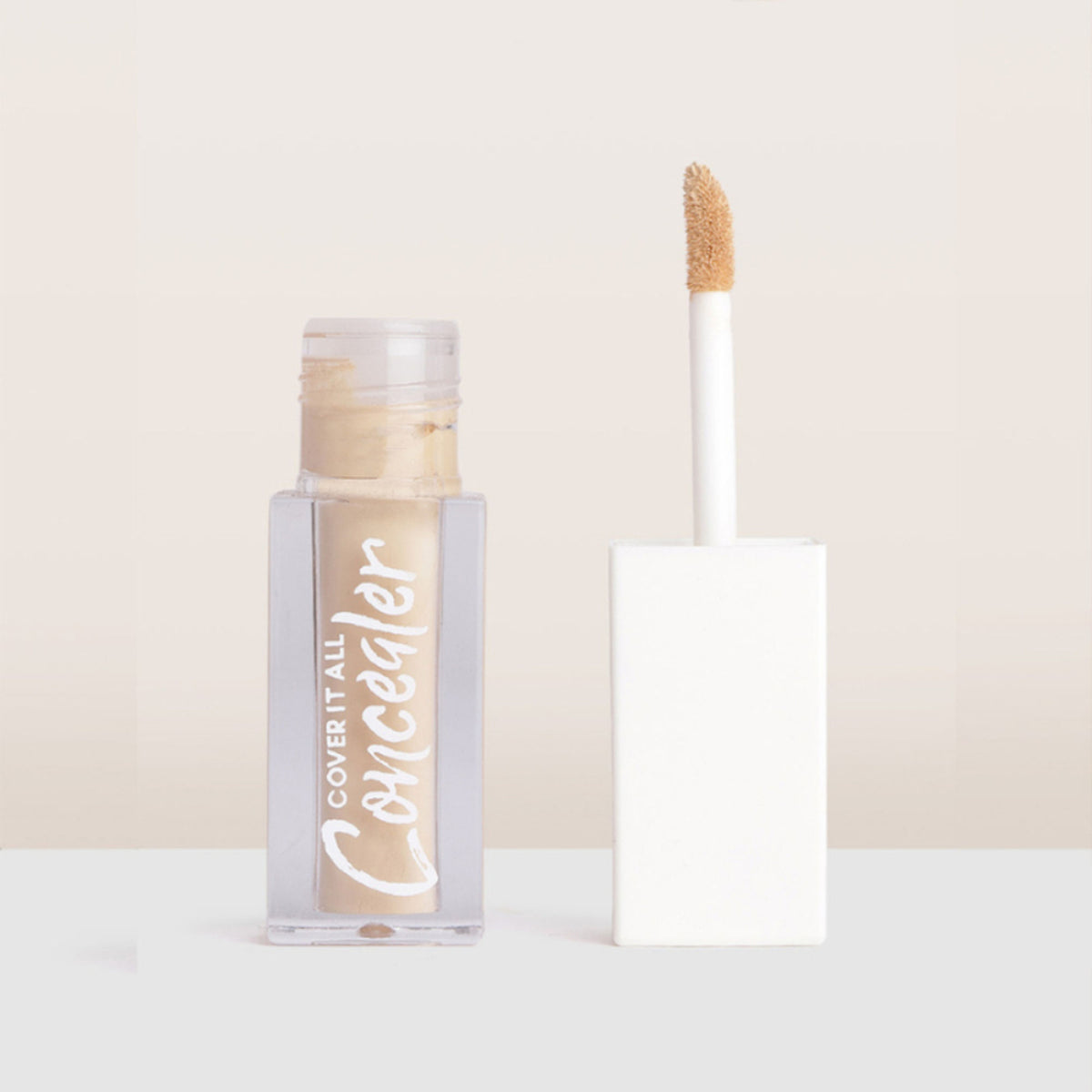 CUFFS N LASHES Cover It All Liquid Concealer in shade 02 Banana, with applicator and smooth creamy texture visible.