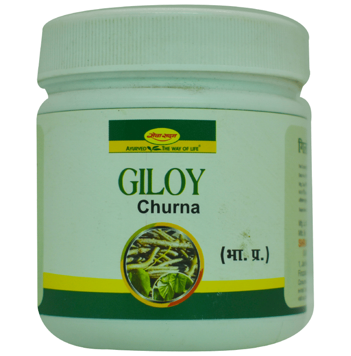 Seva Sadan Giloy Churna, Ayurvedic powder in a glass jar, with a spoon, showcasing the herbal supplement's texture and packaging.
