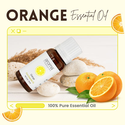 Aroma Treasures Orange Essential Oil bottle with orange slices and floral accents, showcasing the product's natural citrus fragrance.
