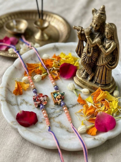 Anouk Set Of 2 Krishna Ji & Ganesh Ji Beaded Religious Thread Rakhi With Roli Chawal
