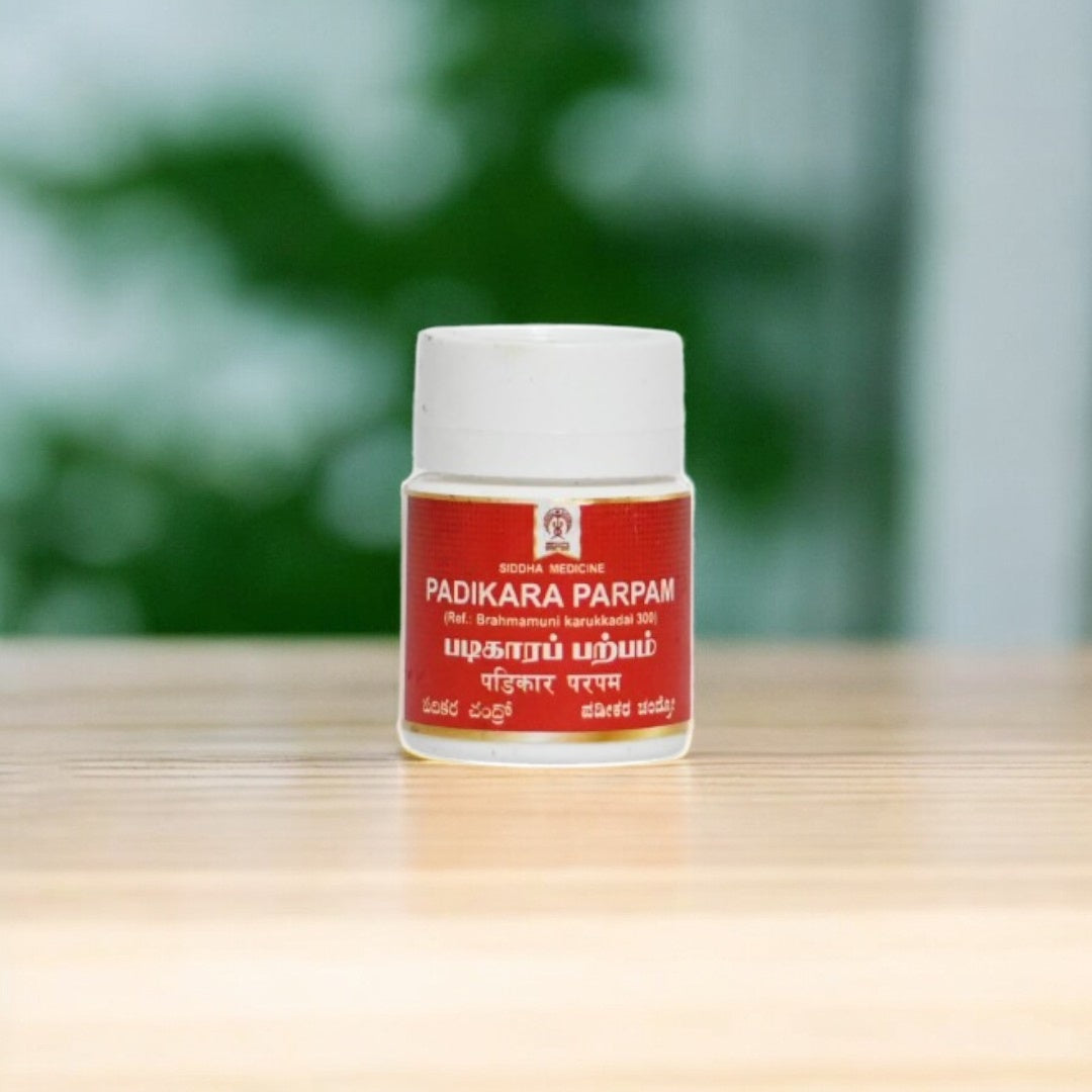 ImpCops Padikara Parpam Ayurvedic herbal powder in a glass jar, traditional Indian medicinal product for health and wellness.