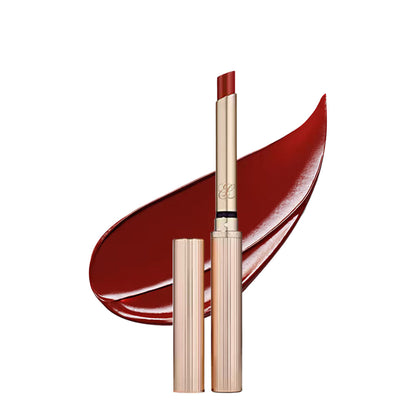 Estee Lauder Pure Color Explicit Slick Shine Lipstick in Heat Of The Moment with sleek packaging and vibrant coral color.