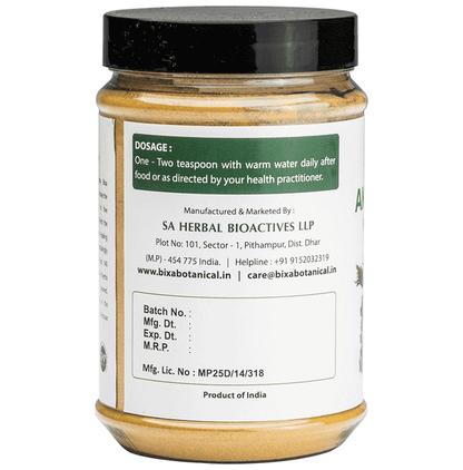 Bixa Botanical Akarkara powder in a clear glass jar, showcasing the fine, light brown Ayurvedic powder on a white background.