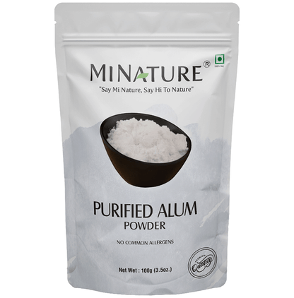 Miniature purified alum powder face pack in a small container, ready for skincare use.