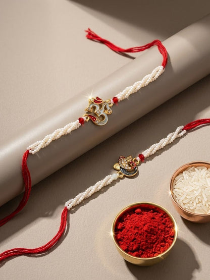 Anouk Set Of 2 White Pearls Om & Ganesh Ji Thread Rakhi With Roli Chawal Chandan Mishri