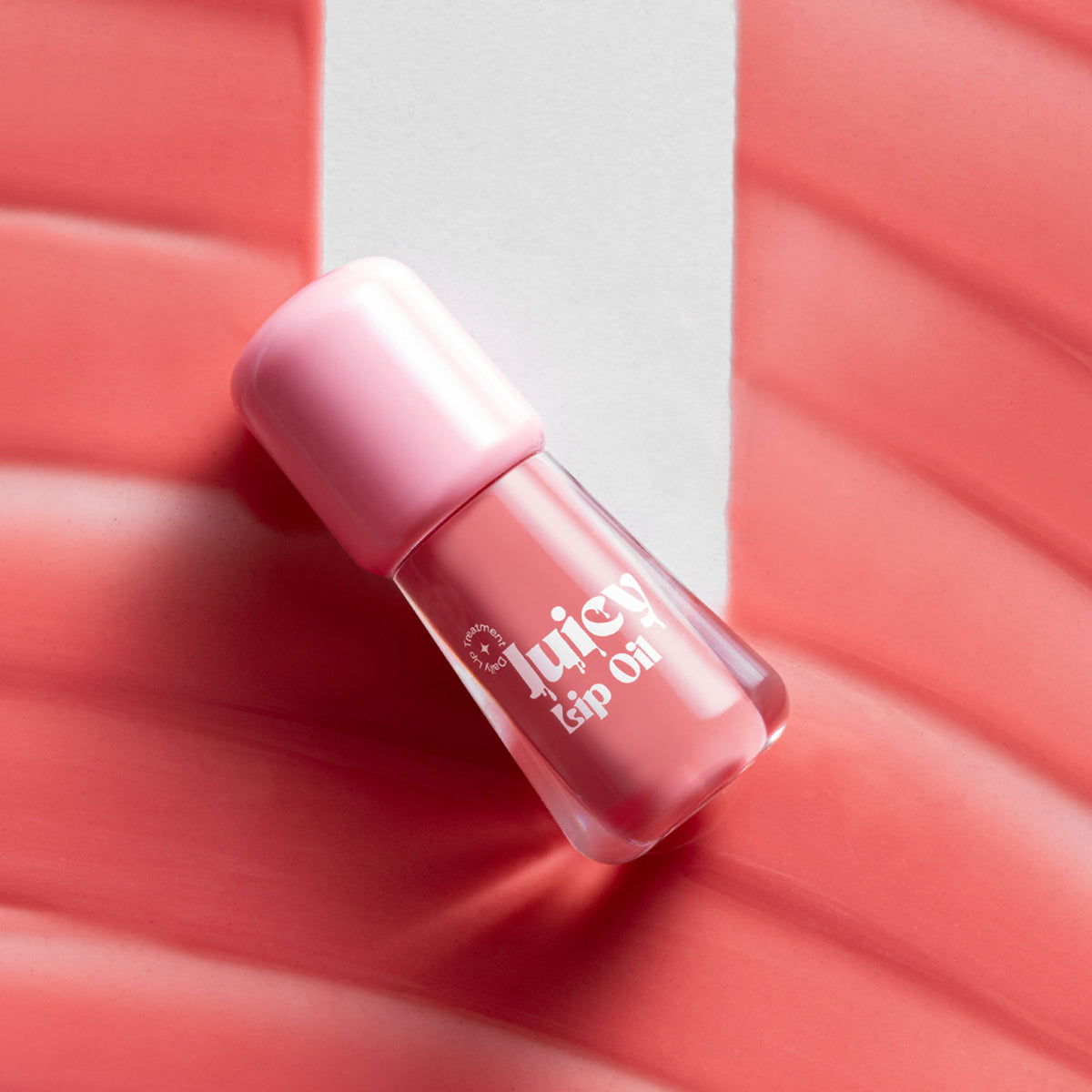 Gush Beauty Balmy Glossy Tinted Lip Oil in Baby Pink, showing a smooth, shiny lip gloss applied on lips with a soft pink tint.